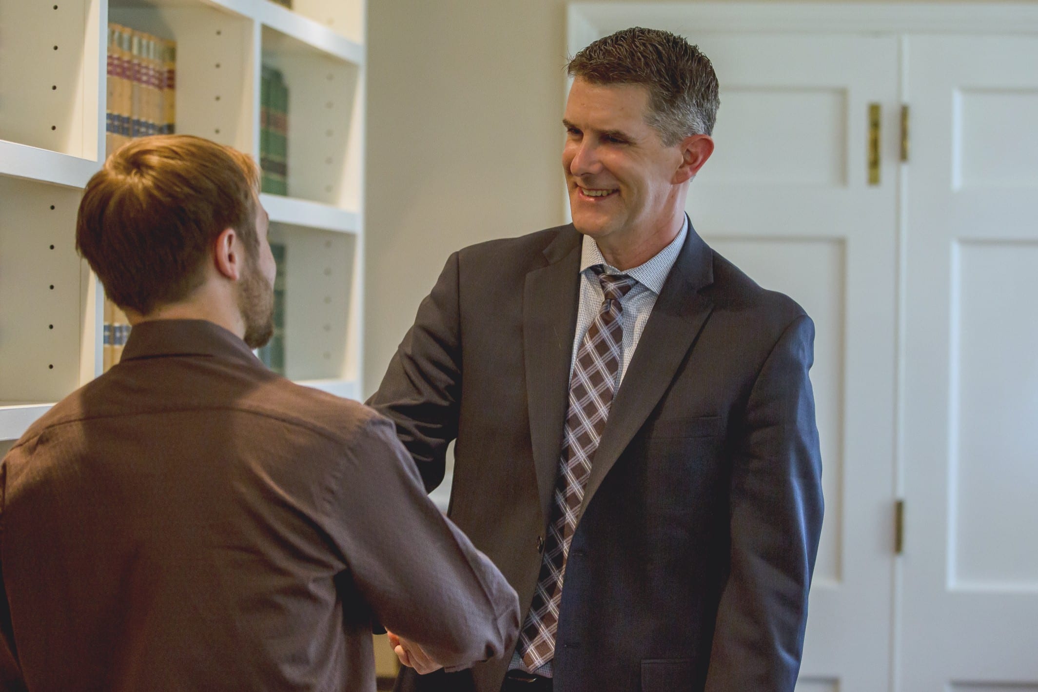 Chris Bugbee welcoming a client at his office